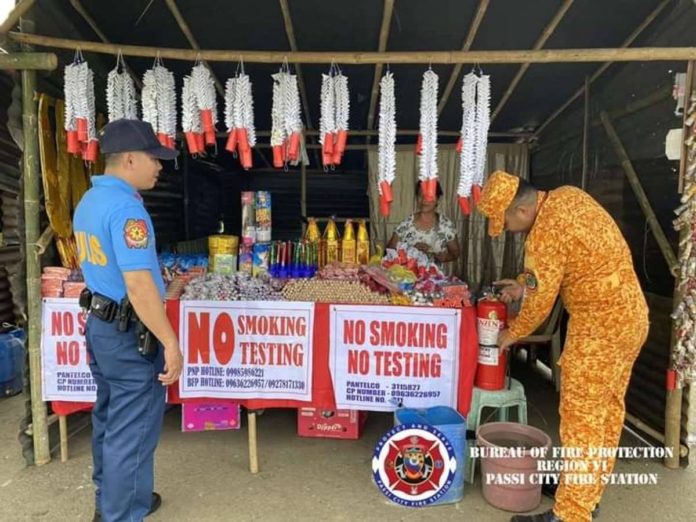 Bureau of Fire Protection personnel in Passi City, Iloilo inspect sellers of firecrackers at the designated area in Barangay Poblacion Ilawod on Thursday, Dec. 28. BFP R6 PASSI CITY FA FB PAGE PHOTO