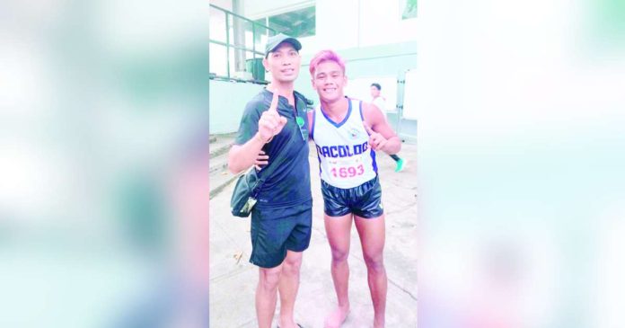 Bacolod City hurdler Mico Villaran with his head coach Miguel Arca. PHOTO COURTESY OF ADDY ARCA