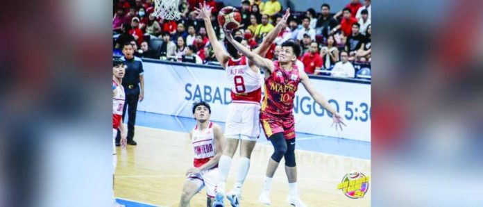 Mapua University Cardinals’ Marc Cuenco evades the defense of San Beda University Red Lions’ Peter Alfaro for a layup. PHOTO COURTESY OF NCAA/GMA SPORTS