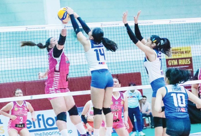 Negros ICC Blue Hawks’ Angel Mae Habacon blocks a shot by a Biñan Tatak Gel I Am Worldwide player. PHOTO COURTESY OF MPVA