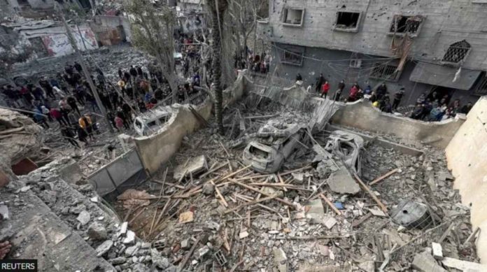 People inspect the site of an Israeli strike on a house in Jabalia, in the northern Gaza Strip. Much of northern Gaza has been reduced to rubble. REUTERS