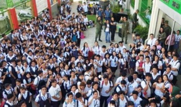 Students at the Felimon Liza Senior High School in Navotas City gather for an event, in this undated file photo. Over 17,000 Grade 11 students currently enrolled in state universities and colleges (SUCs) and local universities and colleges (LUCs) might be displaced once they stop offering the senior high school program. File photo from the Joint Task Force to End Local Communist Armed Conflict