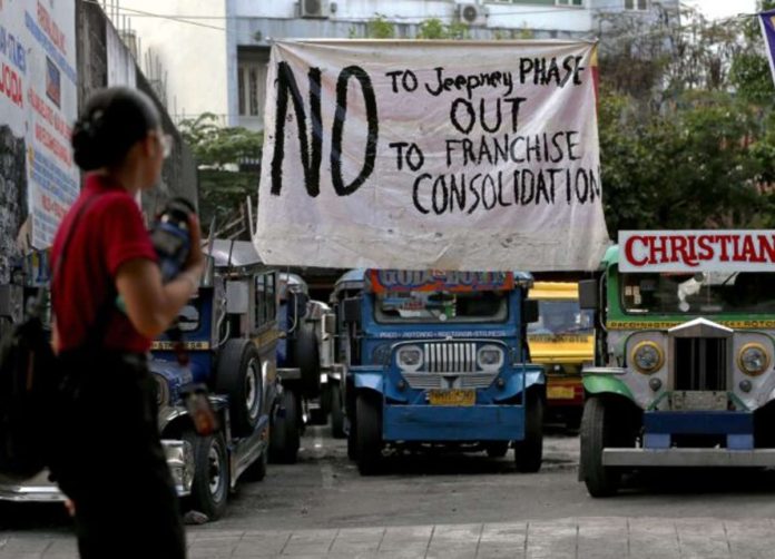 A streamer at a terminal for jeepneys plying the Paco-Rotunda Nagtahan route in Manila expresses the unyielding position of the local transport association about the government’s modernization program for public utility vehicles, in this photo taken on Tuesday, Jan. 2, 2024. Photo by RICHARD A. REYES / Philippine Daily Inquirer