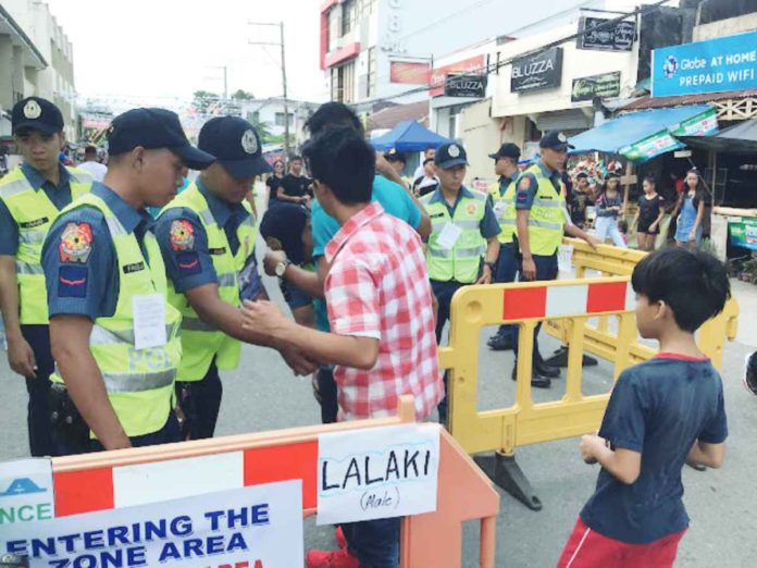 Pedestrian screening areas manned by police were established to secure the safety of Ati-Atihan merrymakers. AKEAN FORUM