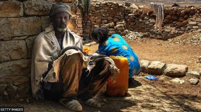 A family in rural southern Tigray collects water. The two-year conflict in Ethiopia plus a drought have left many in a desperate situation. GETTY IMAGES