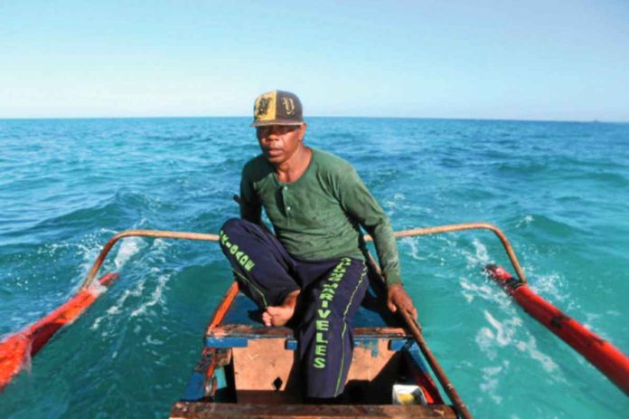 A 50-year-old Filipino fisherman enters the disputed Scarborough Shoal in the West Philippine Sea. PHILIPPINE DAILY INQUIRER PHOTO