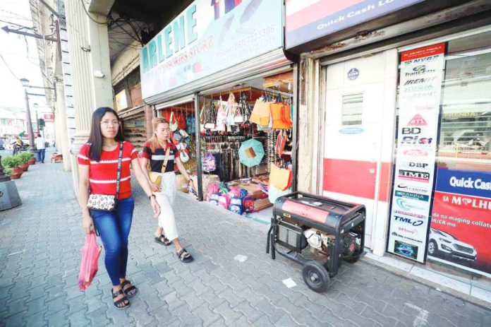 Lacking power generators, some business establishments in Iloilo city and province have been unable to operate since Tuesday afternoon when a massive power interruption hit Panay Island. But some do have power generators like this business establishment in downtown Iloilo City. The portable power generator does not occupy much sidewalk space. ILOILO CITY MAYOR’S OFFICE PHOTO