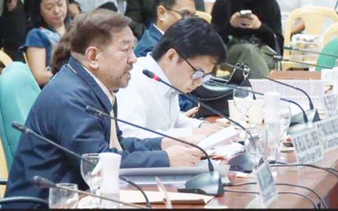 Philippine Charity Sweepstakes Office (PCSO) general manager Mel Robles (left) admitted during a Senate hearing of the subcommittee of Ways and Means on Thursday, Jan. 18, that the viral photo posted on the PCSO social media of a bettor claiming her prize of P43 million from 6/42 draw was indeed edited. SCREENSHOT FROM SENATE YOUTUBE CHANNEL