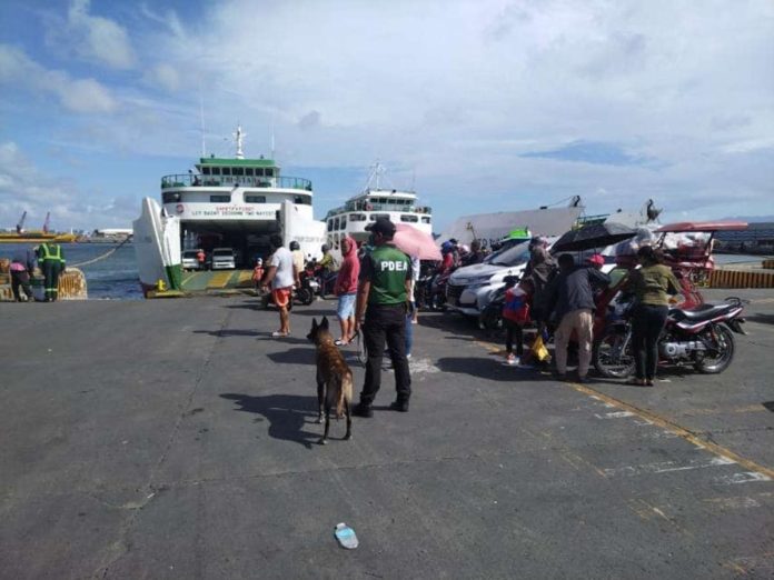 Personnel of the Philippine Drug Enforcement Agency Region 6’s Seaport Interdiction Unit-Negros Occidental conduct K9 inspections at the BREDCO port in Bacolod City on Thursday, Jan. 4. PDEA-6 PHOTO