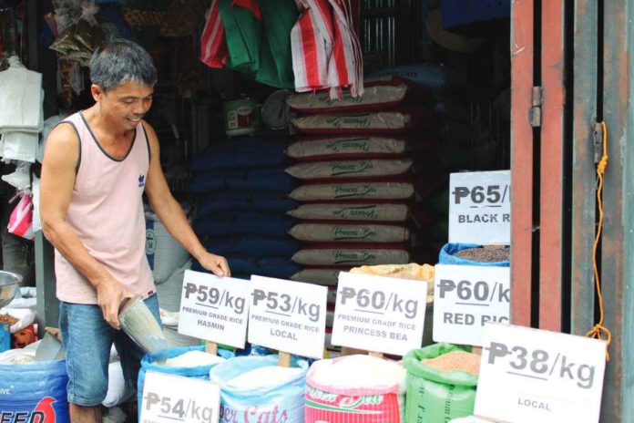 The Iloilo Grains Businessmen Association expresses concern that an abrupt implementation of the suggested retail price on rice could lead to protests from rice traders. Photo shows the current prices of rice at Jaro Big Market in Jaro, Iloilo City. AJ PALCULLO/PN