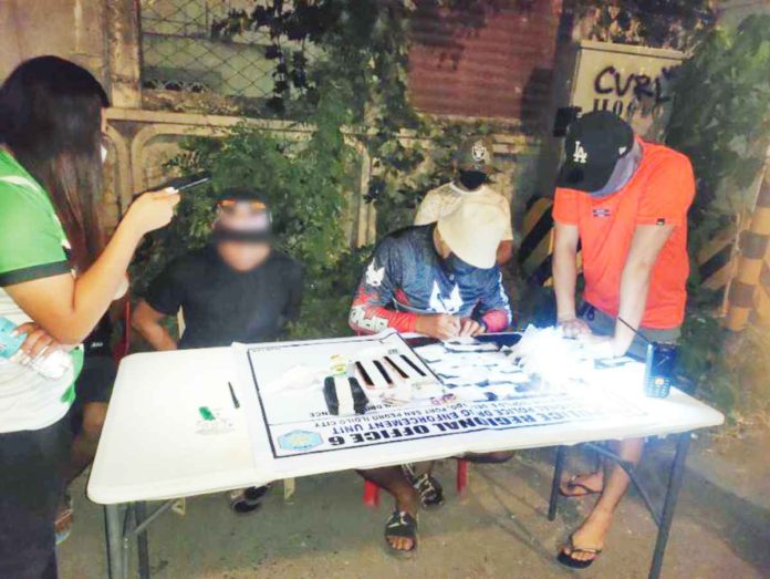 Police authorities document the illegal drug seizures after a successful buy-bust operation in Iloilo City. The P7.95 million suspected shabu was likely intended for disposal this Dinagyang Festival. PRO-6 PHOTO