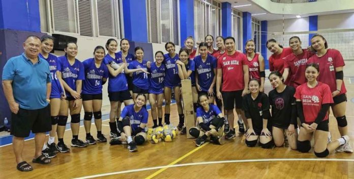 Members of Bacolod Tay Tung High School Thunderbolts (in blue jerseys) during their training session with some members of San Beda University Lady Red Spikers. PHOTO COURTESY OF JOSE MONTALBO