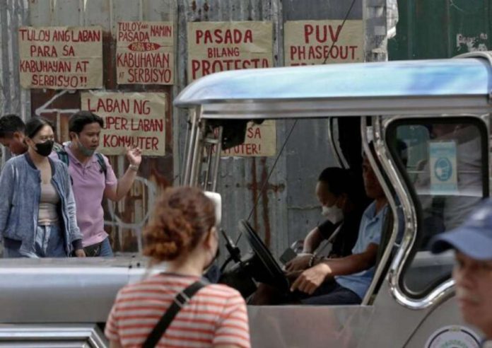 Posters showing sentiments of jeepney drivers against the government’s public utility vehicle modernization program are displayed in a transport terminal in Manila on Monday, Jan. 16, 2024. Photo by RICHARD A. REYES / Philippine Daily Inquirer