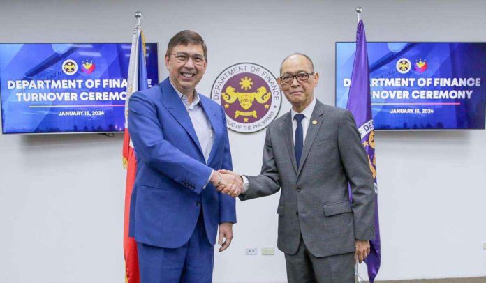 Former Finance secretary Benjamin Diokno officially turns over the Department of Finance leadership to newly appointed Finance secretary Ralph Recto in a ceremony in Manila on Monday, Jan. 15. The turnover ceremony was followed by a series of briefings for Recto, led by the heads of DOF offices. DOF PHOTO