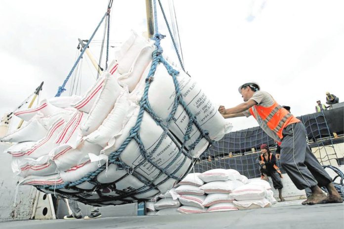 Workers at the Manila Harbour Center unload rice that the National Food Authority bought from Vietnam in the aftermath of Super Typhoon Yolanda. President Ferdinand “Bongbong” Marcos Jr., who is currently in Vietnam for a two-day state visit, is looking forward to signing of a rice deal with Vietnam. INQUIRER FILE PHOTO