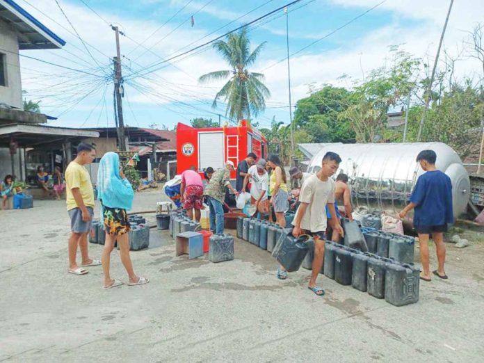 WATER RATIONING. The municipal fire station in Sibalom conducts water rationing in Barangay Lacaron experiencing water scarcity due to the El Niño phenomenon on Saturday, Jan. 27. The Bureau of Fire Protection expressed its readiness to assist local government units in bringing water to their constituents. BUREAU OF FIRE PROTECTION SIBALOM / FACEBOOK