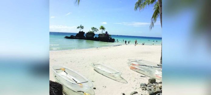 Tourist arrivals in Boracay Island in Malay, Aklan, are forecast to reach 2.3 million this year—higher than the 2.15 million arrivals in 2023. BOY RYAN ZABAL / AKEAN FORUM