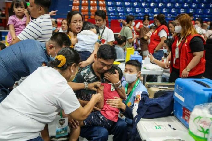 A child reacts as he gets vaccinated against childhood diseases as part of Department of Health’s “Chikiting Ligtas” Vaccine Supplemental Immunization activity in San Juan City. JONATHAN CELLONA, ABS-CBN NEWS/FILE PHOTO