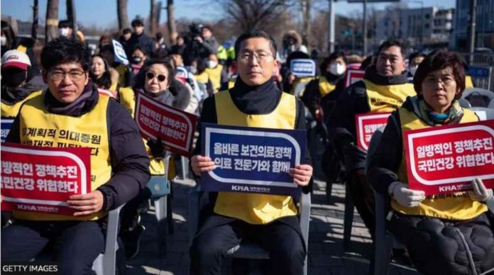 Doctors stage rallies in Seoul, South Korea protesting against the government’s plan to bump up numbers. GETTY IMAGES