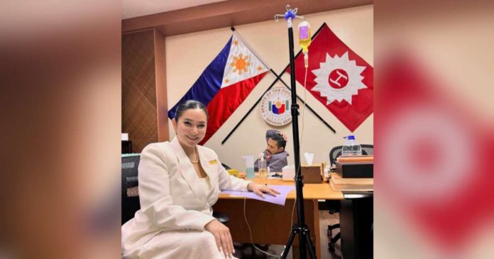 Mariel Padilla poses as she received her dose for 'IV drip' at the Senate office with Sen. Robin Padilla sitting in the background. INSTAGRAM/@MARIELTPADILLA