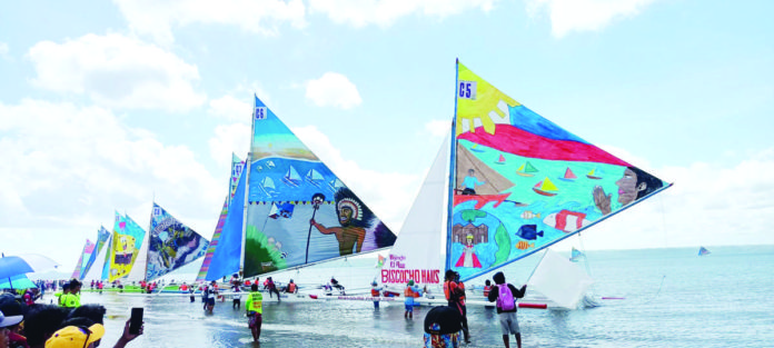 Colorful paraws set off from the shoreline of Arevalo district in Iloilo City during last year’s main sailing event of the Paraw Regatta Festival. PN FILE PHOTO