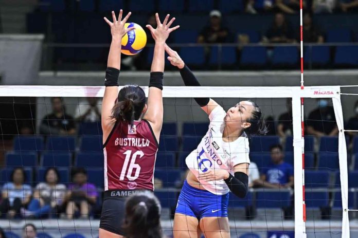 Ateneo de Manila University Blue Eagles’ Lyann de Guzman smashes the ball towards the defense of University of the Philippines Fighting Maroons’ Stephanie Bustrillo. UAAP PHOTO