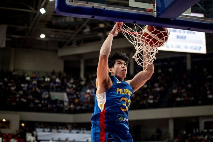 Gilas Pilipinas’ Carl Tamayo scores on a two-handed dunk. FIBA PHOTO