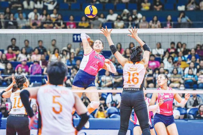 Creamline Cool Smashers’ Risa Sato attempts an attack against Farm Fresh Foxies Riza Cruz. PVL PHOTO