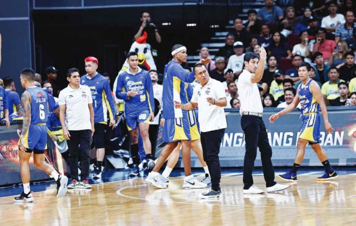 Magnolia Chicken Timplados Hotshots head coach Chito Victolero gestures towards the referees during Game 2 of the 2023-2024 PBA Commissioner’s Cup finals against San Miguel Beermen last Sunday. PBA PHOTO