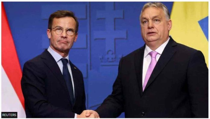 Swedish Prime Minister Ulf Kristersson and Hungarian Prime Minister Viktor Orban shake hands at a joint press conference in Budapest, Hungary, on Feb. 23, 2024. REUTERS