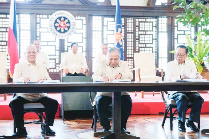 (From left) San Miguel Corp. president Ramon S. Ang, Transportation Secretary Jaime Bautista and Manila International Airport Authority General Manager Eric Jose Ines signed the public-private partnership agreement for the rehabilitation of the Ninoy Aquino International Airport on Monday, March 18. The signing was witnessed by President Ferdinand Marcos Jr. BONGBONG MARCOS/FACEBOOK PHOTO