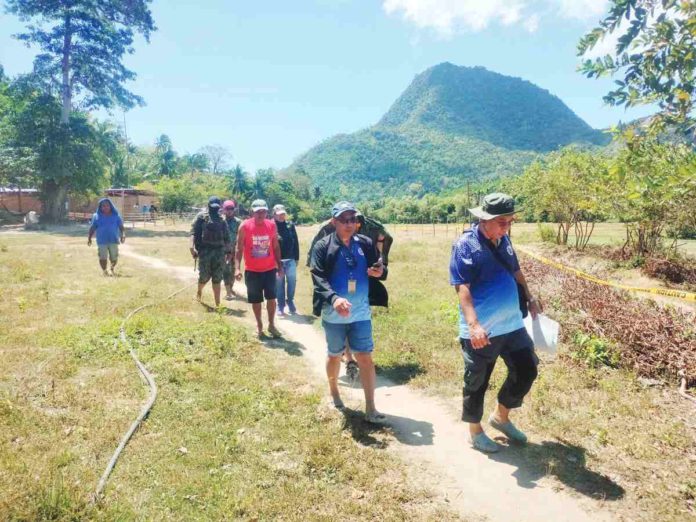 The Iloilo Provincial Government Environment and Natural Resources Office, headed by Atty. Cesar Emmanuelle Buyco Jr., serves a cease and desist order against TVI Resource Development (PHILS) Inc. and Mindoro Resources LTD to halt mineral exploration activities on Pan De Azucar Island in Concepcion, Iloilo, on Thursday, March 7. PHOTOS COURTESY OF SGT. ROD’Z ASTURIAS