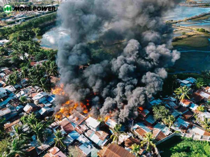 This drone shot shows the fire raging in Zone 1, Barangay Old Airport, Mandurriao, Iloilo City on Tuesday morning, March 5. Ninety-six houses were gutted and 115 families were displaced. MORE POWER PHOTO