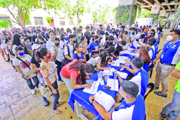 The increase in joblessness and decline in employed persons in January 2024 was attributed to the easing of labor demand following the “peak of seasonality” in December last year, according to the Philippine Statistics Authority. Photo shows jobseekers lining up to get an application form at a mega job fair in Manila. DANNY PATA PHOTO