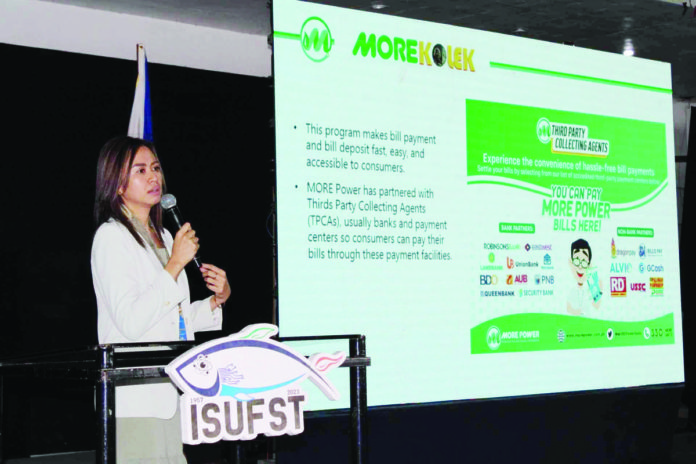 Atty. Allana Mae A. Babayen-on, AVP, Legal Officer of MORE Electric and Power Corporation, discusses the pivotal role of MORE Power in fostering progress and growth within the city and province of Iloilo during the Business and Investment Symposium at the Iloilo State University of Fisheries Science and Technology - Barotac Nuevo campus. AJ PALCULLO/PN