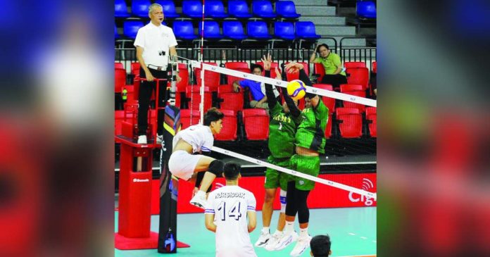 Iloilo D’Navigators’ Kyle Angelo Villamor smashes the ball towards the defense of Philippine Army Defenders in the recent PNVF Champions League. PNVF PHOTO