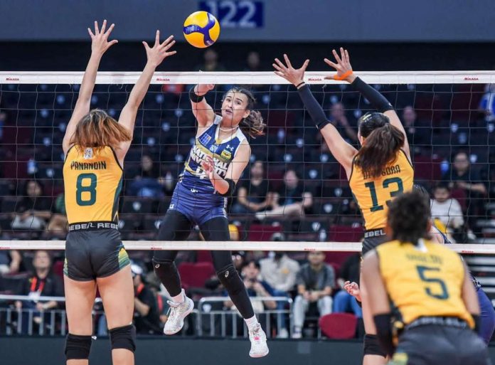 National University Lady Bulldogs’ Mhicaela Belen scores against the defense of Far Eastern University Lady Tamaraws. UAAP PHOTO