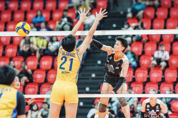 Negrense Alyssa Bertolano of Farm Fresh Foxies scores against the defense of Capital1 Solar Energy Solar Spikers’ Shirley Salamagos. PVL PHOTO