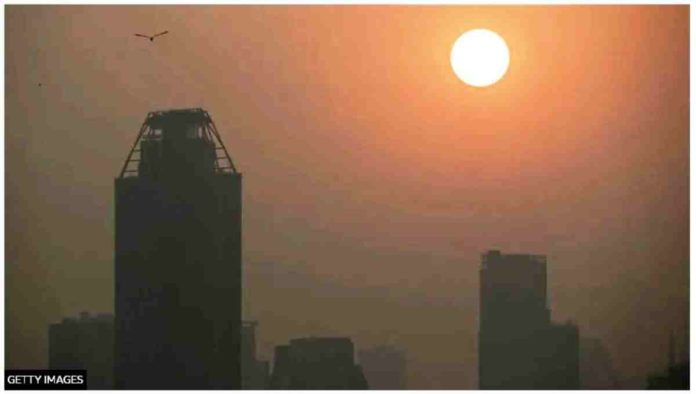 The sun rises amid high air pollution levels in Bangkok, Thailand. Air pollution turns the view of Bangkok's skyline into shadows. GETTY IMAGES