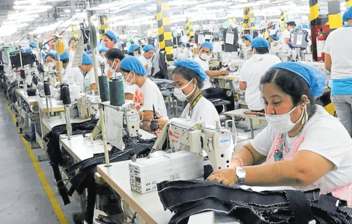 Laborers are busy working in a factory at the Mactan Export Processing Zone (MEPZ) in Lapu-Lapu City, Cebu. MEPZ WORKERS ALLIANCE/FACEBOOK PHOTO