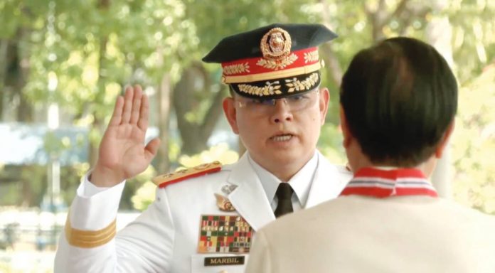 Major General Rommel Francisco Marbil takes his oath as the 30th Philippine National Police chief before President Ferdinand Marcos Jr. in Camp Crame, Quezon City, on April 1, 2024. SCREENGRAB FROM RTV MALACAÑANG