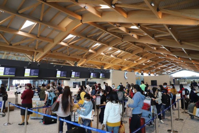Passengers line up at the check-in counters of the Clark International Airport new terminal building. The airport hit nearly 2 million passengers in 2023. BCDA PHOTO