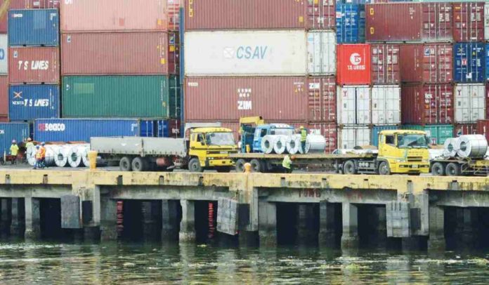 Shipping containers of Philippine products for export sit stacked along the docks of the international container port in Manila. PHOTO: JAY DIRECTO/AFP/GETTYIMAGES