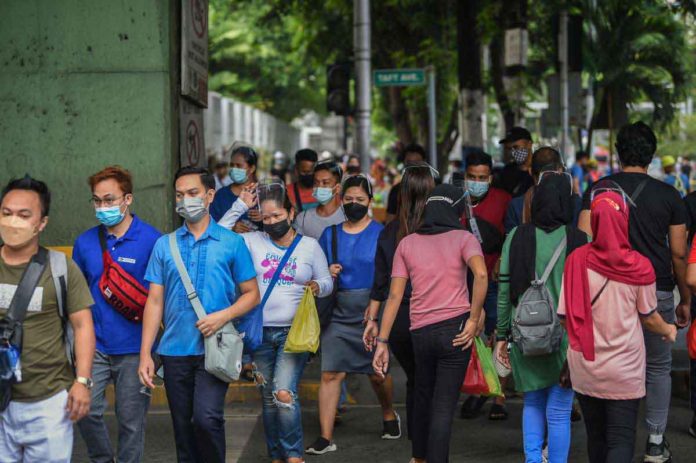 Mandatory wearing of facemasks is already necessary in areas that declared pertussis outbreak and those with reported high number of cases, according to a former special adviser of the National Task Force against COVID-19. TED ALJIBE/AFP/PHILIPPINE DAILY INQUIRER