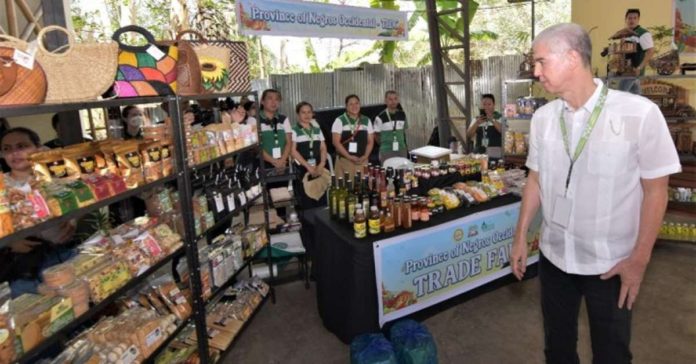 Gov. Eugenio Jose Lacson checks out the display at the trade fair of the Food Security Fair and Exhibit at Panaad Park and Stadium in Bacolod City on Monday, April 15. The event is part of the 28th Panaad Sa Negros Festival. PIO NEGROS OCCIDENTAL PHOTO