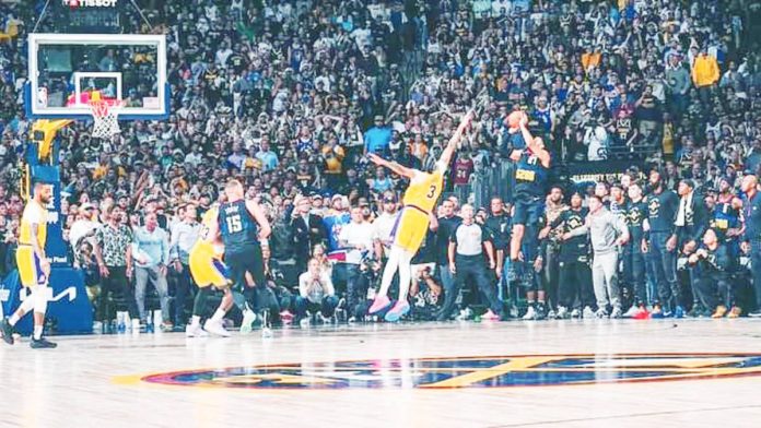 Denver Nuggets’ Jamal Murray shoots a game-winning basket against the defense of Los Angeles Lakers’ Anthony Davis. PHOTO COURTESY OF DENVER NUGGETS