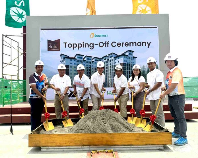 In photo are officials from Suntrust and its partners present at the topping off: (from left) Engr. Wilfredo Cabalce Jr., Cabalce Electrical Contractors, Assistant Vice President, Jerry R. Rubis, Suntrust First Vice President for Sales, Marketing, and Training, Isaias D. Berdin Jr., Suntrust Vice President for Operations, Planning, and Design, Atty. Basilio C. Almazan Jr., Suntrust Senior Vice President, Virgilio Bucat, Sagada Construction and Development Corporation President, Marjorie Bucat, Sagada Construction and Development Corporation Vice President, Arch. Manolito V. Elmann, Suntrust Assistant Vice President - Vertical Operations, Arnel Abalos, HOABI HR Executive.