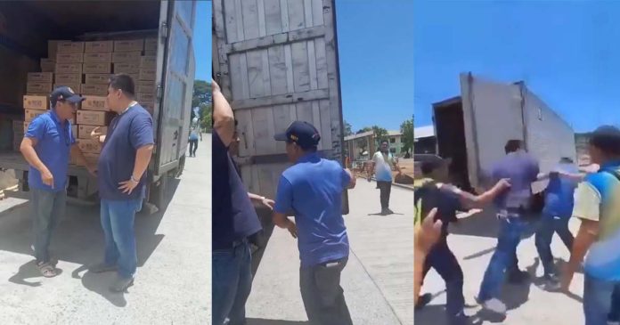 Tobias Fornier, Antique’s Mayor Ernesto Tajanlangit (left) and Vice Mayor Jojo Fornier (right) confront one another at the back of a van carrying family food packs on Monday, April 29. Mayor Ernesto Tajanlangit/FB