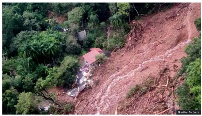 A view of a house in a flooded area taken from a helicopter. BRAZILIAN AIR FORCE