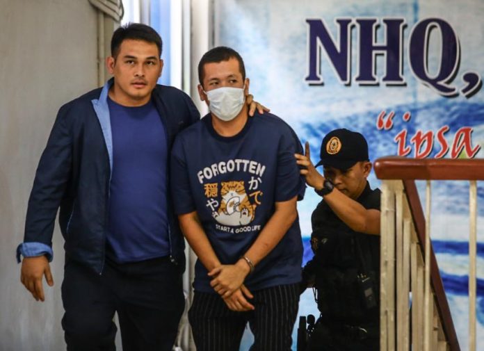 Gerrard Raymund Yu, suspect in the fatal shooting resulting from a road accident on the southbound lane of the EDSA-Ayala Avenue tunnel in Makati City, arrives at Camp Crame, Quezon City on May 29, 2024 and is introduced to the media by Interior Secretary Benhur Abalos and Philippine National Police Chief Gen. Rommel Marbil. Yu, who was driving a Mercedes-Benz, shot and killed a 65-year-old family driver who was traveling with a woman and a child in a Toyota Innova toward Alabang at around 2:30 p.m. on May 28. PNA